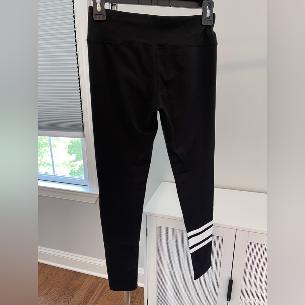 Leggings.   Black with white stripes. Ankle length (I’m 5’7”). Size S by Mona B.